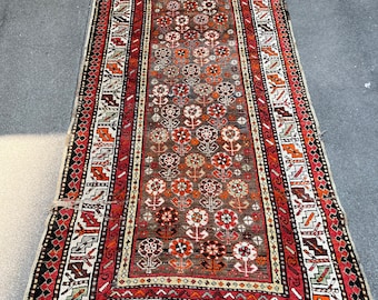 Old carpet with flowers from the first half of the 20th century