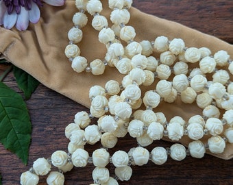 long cream long necklace, rose-shaped beads