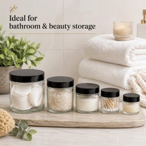 Five sizes of clear glass cosmetic jars with black screw lids, available in 15ml, 30ml, 60ml, 120ml and 250ml capacities.