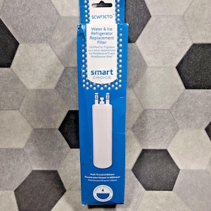May include: A blue and white rectangular box containing a water and ice refrigerator replacement filter. The packaging features the text SCWF3CTO, Smart Choice, and indicates it is a replacement for PureSource3 and PureSource Ultra filters.
