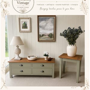May include: A sage green wooden coffee table with four drawers and a natural wood top, paired with a matching sage green side table. The coffee table holds a lamp and a bowl, while the side table features a white vase with blue flowers.