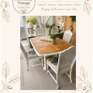 May include: A rectangular wooden dining table with a light brown top and white base, accompanied by four white chairs featuring floral patterned fabric seats and woven backrests. The table surface displays a geometric wood grain pattern.