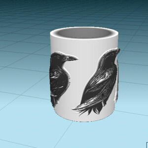 May include: White ceramic mug with two black crow silhouettes on the side.