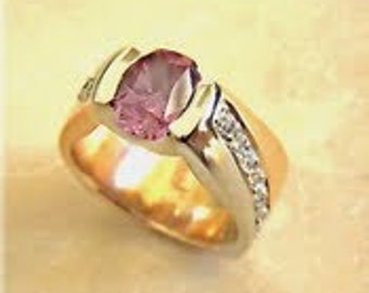 Pink sapphire and diamond ring set in 18k rose and white gold ( sapphire is color change)