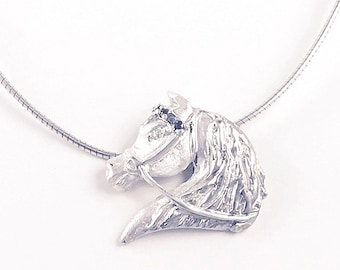 Horse head pendant in sterling silver with blue sapphires