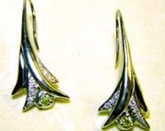 Yellow diamond and white diamond earrings set in 18k white gold