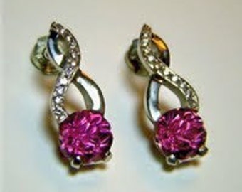 Salmon Tourmaline and diamond earrings set in 18k white gold
