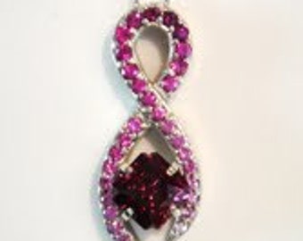 Raspberry Rhodolite Garnet and pave pink sapphire pendant in 14k white gold.