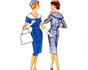 May include: Two women wearing blue dresses with white collars. One dress is solid blue, the other has a white and blue pattern. Both women are wearing white gloves and blue shoes.