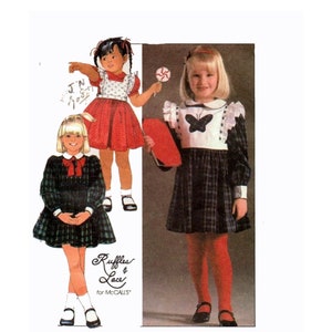 Vintage 1980s McCalls 8680 Childrens' Full Ruffled Dress with Detachable Butterfly Sleeve Bib Sewing Pattern