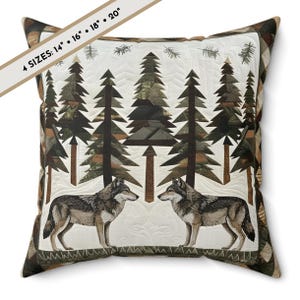 May include: Square decorative pillow with a quilted design featuring a forest scene with pine trees and two wolves. The pillow has a white background with brown, green, and gray accents. The text on the image reads: 4 SIZES: 14" • 16" • 18" • 20".