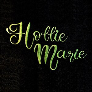 May include: Embroidered name "Hollie Marie" in green cursive lettering on a black background.