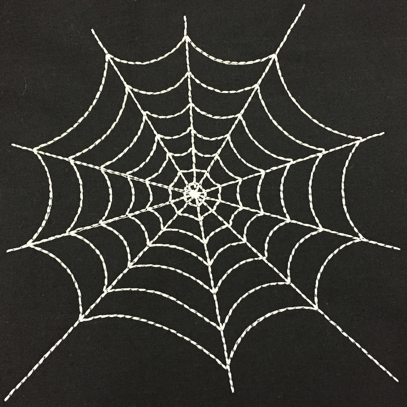 May include: White spider web embroidered on a black fabric background.