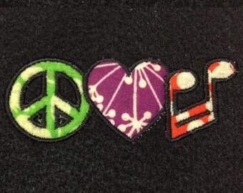 Peace, love and music machine applique design. Two different versions in three sizes.