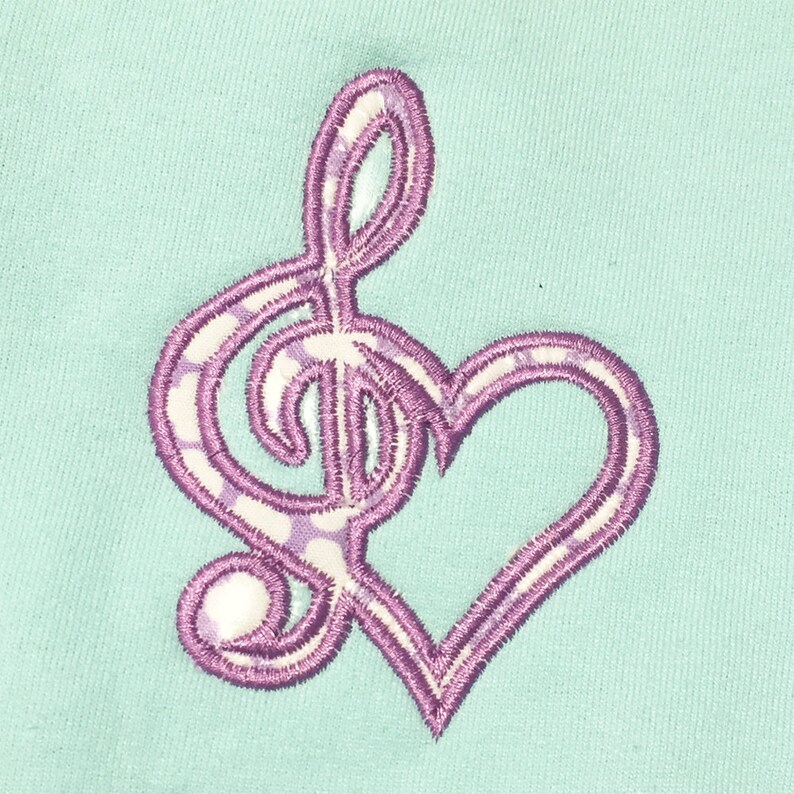 Treble clef and heart filled machine embroidery and applique designs for a music lover. 6 versions in multiple sizes. image 1