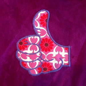 Thumbs up! It&#39;s all good with this silly applique and embroidery design.  Thumbs up (a-ok) design in 5 different versions