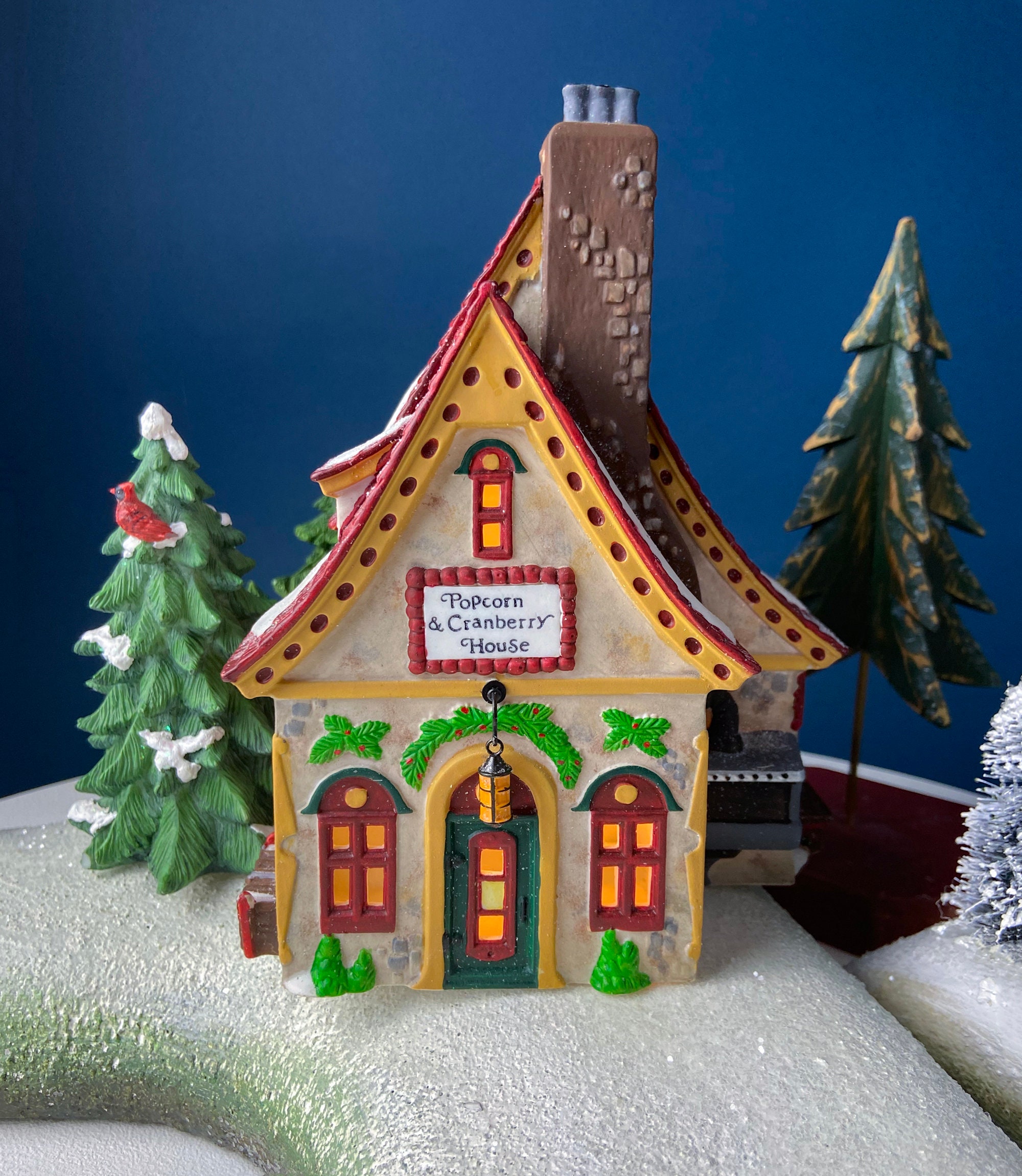 Popcorn and Cranberry House. Illuminated Porcelain Christmas