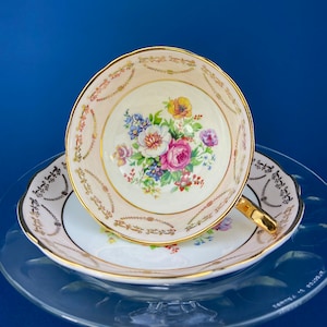 Regency Tea Cup and Saucer. Antique Hand-Painted Porcelain Cup and Saucer. Peach with Wild Flower Bouquet Motif. Made in England.