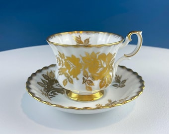 Vintage White and Gold Cup and Saucer. Royal Albert "Golden Rose. " Fine Bone China. Hosting Necessities. Tea Party. Collectibles.