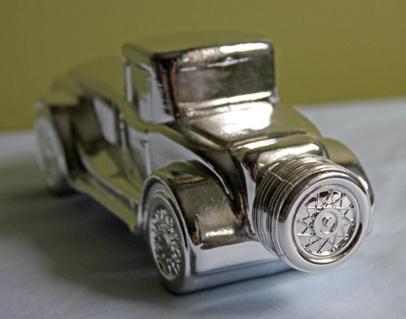 Avon Collectible Car Shaped Bottle. Cologne Silver Bottle