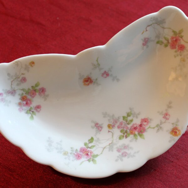 Victorian Limoges bone plate in crescent shape with tiny roses.