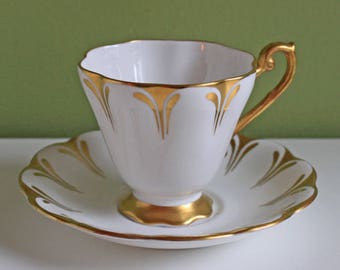 Vintage Tea Cup and Saucer with Gold Rim and Handle. Made by Royal Standard in England.