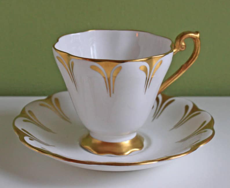 Porcelain Tea Cup and Saucer With Gold Rim and Handle. Made by Etsy Canada