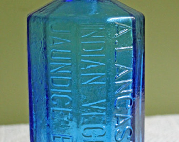 Antique Blue Bottle With Cork. Bottle With Embossed Colonel Sam Johnson