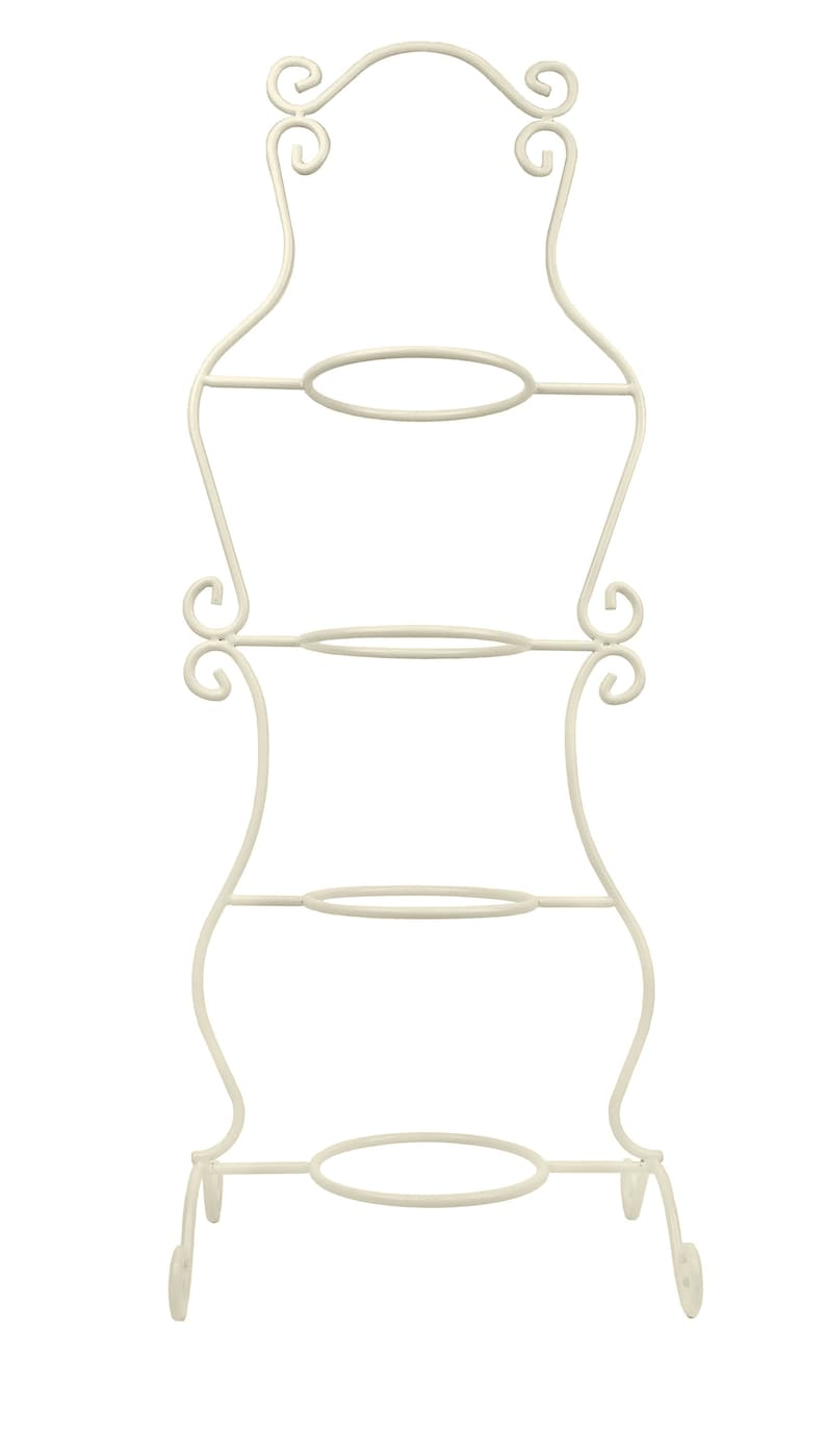 May include: A white metal cake stand with three tiers and ornate scrollwork details. The stand has a decorative top and three legs.