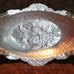 Platter or Tray.  Hand Wrought Aluminum Oval Platter or Tray with Ornate Handles. Flower Bouquet Relief.