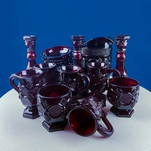 Vintage Ruby Red Avon Cape Cod Dish 16 Set. 5 Dessert Bowls 5 Mugs Pitcher 2 Cups, 3 Candle holders. Pressed Glass Roman Rosette Pattern.