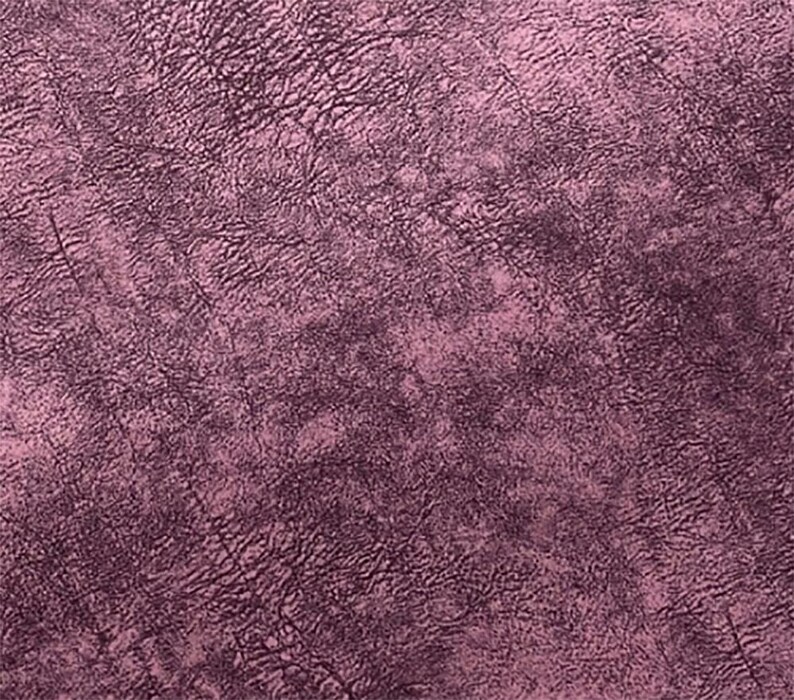 May include: Close-up of a textured surface with a deep rose color. The surface has a mottled appearance with darker, vein-like patterns throughout, creating a sense of depth and visual interest. The overall effect is reminiscent of aged leather or a similar material.
