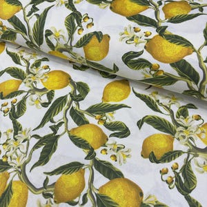 May include: White fabric with a repeating pattern of yellow lemons, green leaves, and white blossoms. The lemons are detailed with shading, and the leaves and blossoms are scattered across the fabric.