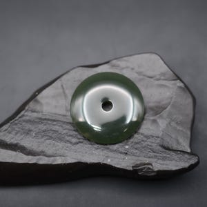 A Hand Carved Chinese Nephrite Olive &quot;Bi Disc&quot; Pendant - JSK-034