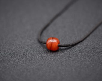 A Hand Carved Red Banded Agate Bead/Pendant- DHB-035