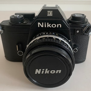 Nikon EM camera, Speedlight SB-E Flash, Topkina Zoom lens