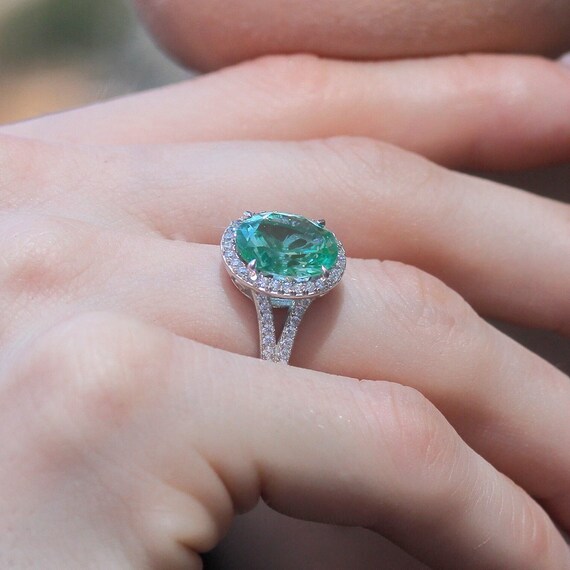 Aqua Blue Ring with Cubic Zirconia Halo Rose Gold-plated Sterling Silver Aqua Blue Ring with Cubic Zirconia Halo Rose Gold-plated Sterling Silver