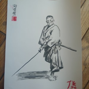 May include: Black and white ink drawing of a person holding a sword. The person is wearing a traditional Japanese robe and has a serious expression on their face. The drawing is signed in Japanese characters.