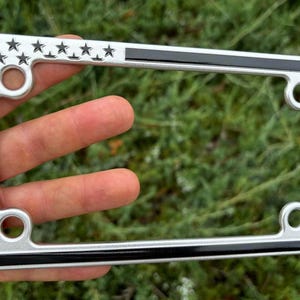 Silver and Black American Flag Patriotic Motorcycle Aluminum License Plate Frame Tag Bracket. 3D Raised Including Mounting Hardware