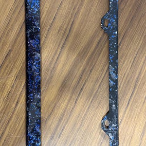 Real Blue Flakes forged carbon fiber license plate frame including mounting hardware