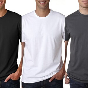 May include: Three plain t-shirts in black, white, and gray. The shirts are crew neck and short-sleeved.
