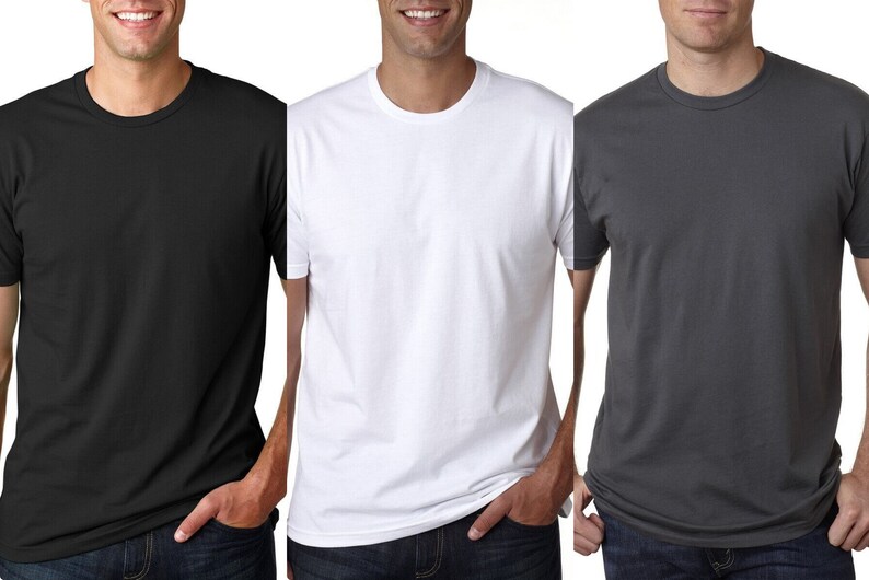 May include: Three plain t-shirts in black, white, and gray. The shirts are crew neck and short-sleeved.