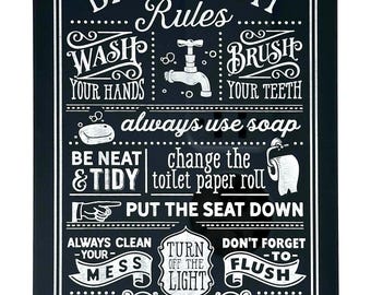 May include: Black rectangular bathroom sign with white text. The sign lists bathroom rules such as "Wash Your Hands," "Brush Your Teeth," and "Always Use Soap." Decorative scrollwork frames the text, and the sign ends with "Thank You!"