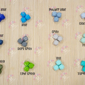 May include: A variety of colors of silicone teething beads in a geometric shape. The colors include royal blue, powder blue, glacier blue, blue, dark blue, gray, dark gray, army green, lime green, teal, mint, and turquoise.