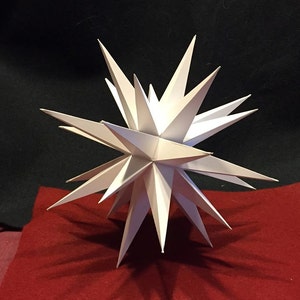 Nine (9) inch White Hanging Moravian Star (may be converted to tree topper-instructions provided).