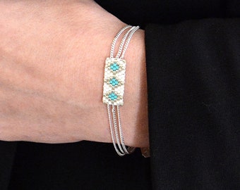 Dames turquoise zilveren armband, dames zilveren armband, fijne zilveren manchetarmband, damesarmband met meerdere ringen | “Andros”