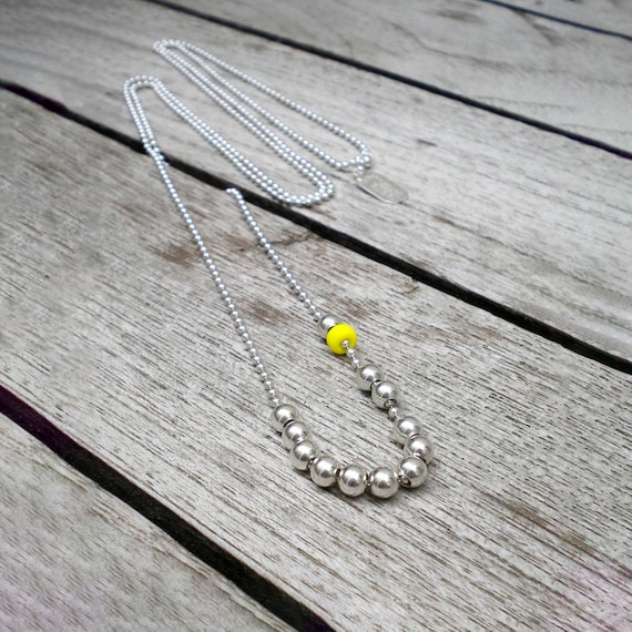 Long yellow beaded necklace discount