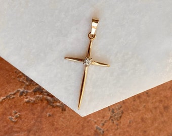 Gold cross with diamond best sale center