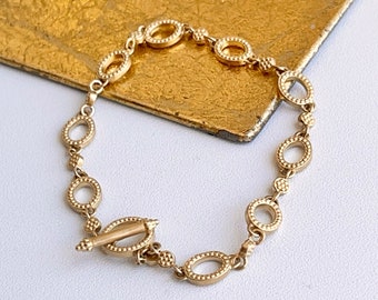 Armband i 14 karat gult guld med glänsande rundade länkar, vipplås 18 cm, NYTT, sammankopplat