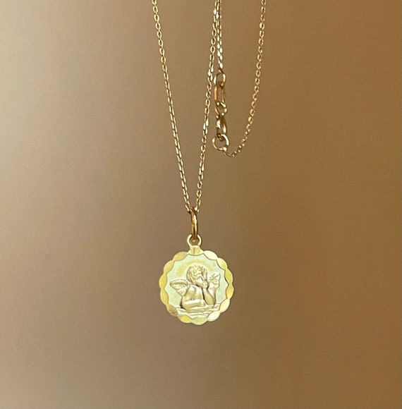 Gold cherub necklace deals